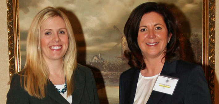 U.S. Army Corps of Engineers fish biologist, Kelly Baerwaldt (left) accepts the Junior Scientist of the Year Award from Quad City Engineering and Science Council.  QCESC photo.